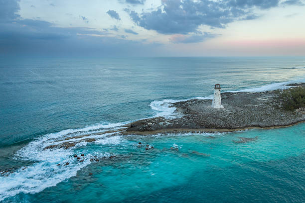Exposure done at sunset of the Nassau Harbour Lighthouse near Colonial Beach, built in 1847, with the awesome turquoise blue waters surrounding the beautiful island of the Bahamas