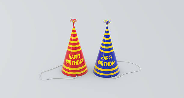 Young funny man blowing party horn during birthday celebration and making silly faces