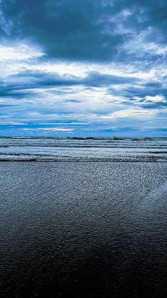 istock A dramatic view of a beach under a moody cloudy sky 2251012246