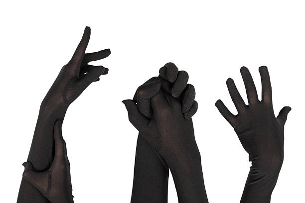istock Woman puts on long black gloves isolated on a white 2251013216