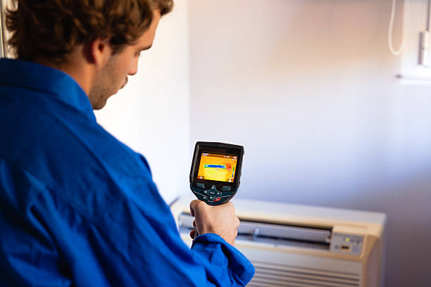 istock Technician inspecting air conditioner with thermal camera 2251015445