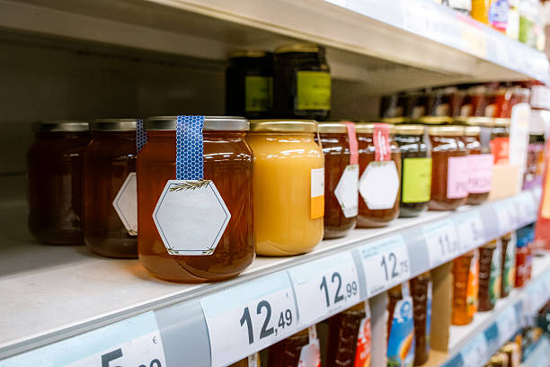 Honey jars in a supermarket shelf