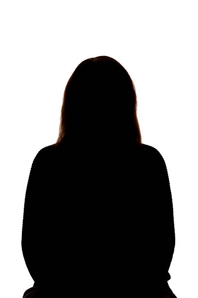 istock Silhouette of young woman facing camera on white background 2251023325