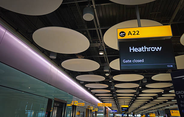 London, United kingdom, Novmber 25 2025: Heathrow airport terminal interior with gate a22 sign and modern ceiling design