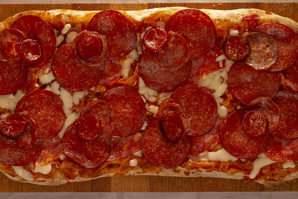 istock Freshly baked flatbread with spicy pepperoni and bubbling cheese topping 2251028951