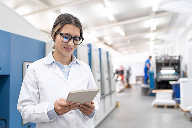 istock Woman specialist working in a modern printing house 2251031078