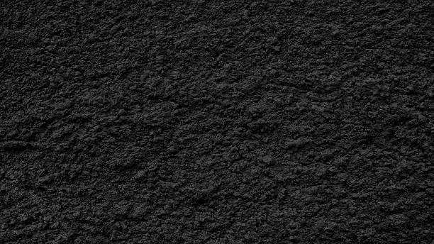 istock Black wall with a rough, grainy texture as a textured background for  web banner template page design 2251032976