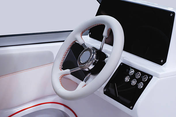 istock A white boat with a steering wheel and a black dashboard 2251034044