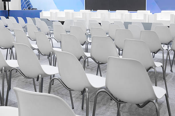 istock A large presentation room with many white chairs arranged in rows. The chairs are empty and the room is the most beautiful 2251035637