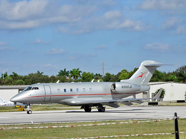 Boca Raton, Palm Beach County, Florida – USA, December 5, 2025. A Bombardier 100-1A10 fixed wing multi engine (8 seats / 2 engines) N300JE taking off from the Boca Raton Airport.