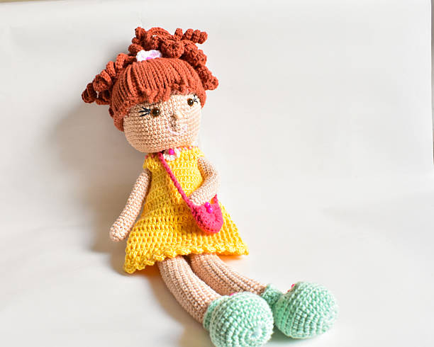 Small and cute Amigurumi doll on white background.Image of a Japanese children's cafeteria