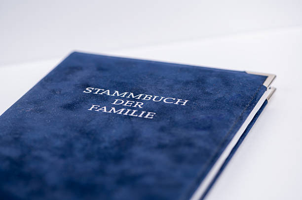 istock Family record book with blue cover on a table 2251037613