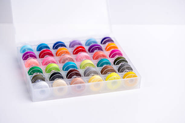 istock Collection of colorful threads in a clear storage box 2251037675