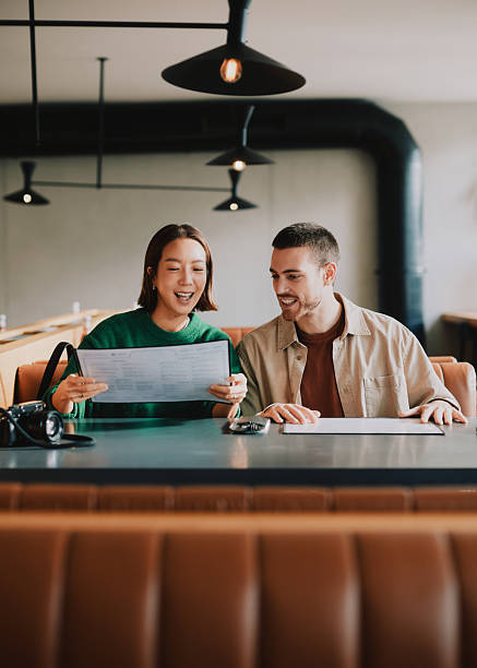 istock A young couple in a restaurant looking at the menu 2251039929