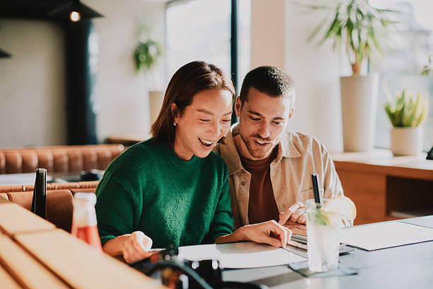 istock Joyful Married Couple Enjoying a Warm Dining Experience at a Modern Restaurant 2251040113