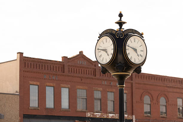 Anadarko, Oklahoma, USA - April 4, 2025: A wrought iron clock with the city's name plate stands in historic downtown.