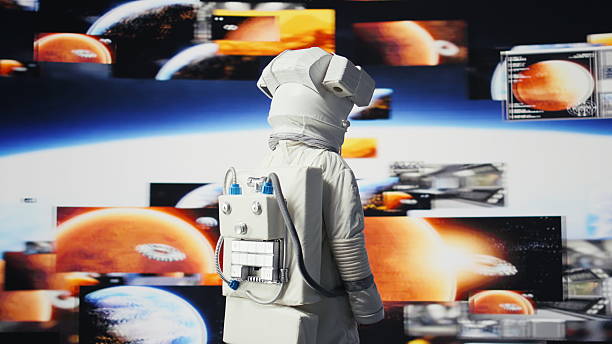 istock Male astronaut in a space suit floats in orbit above Earth 2251047594