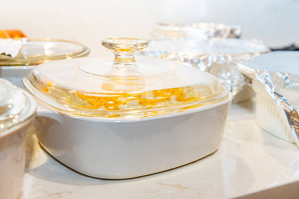 This is a photograph of side dishes covered on the kitchen counter before being served with Thanksgiving dinner.