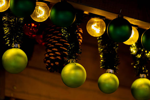 Christmas decorations with colorful ornaments, glowing lights, festive tree baubles, tinsel and garlands, holiday interior setup, winter seasonal decor, cozy home ambiance, sparkling festive details in indoor setting
