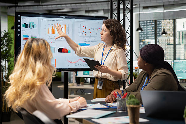 istock Diverse professionals focus on report writing and analytics in a meeting 2251052391