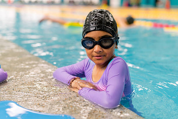 istock Girl learning swimming during lesson at pool 2251058466