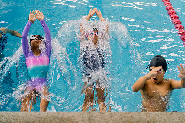 Instructor talking to people before swimming class