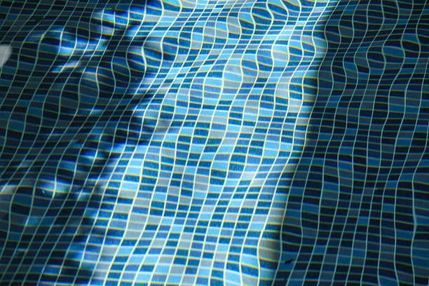 Swimming pool with blue crystal clear water surface and ripple wave background