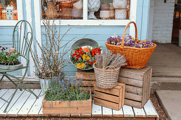 istock Colorful flowers and rustic decor displayed outside a quaint shop in springtime 2251059030
