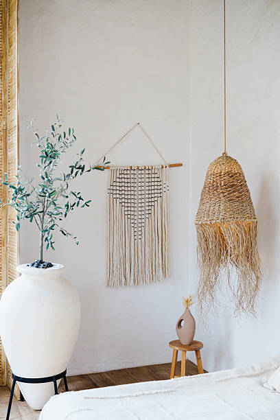 istock Boho room decor with large white vase macrame wall hanging woven lamp and stool 2251059095