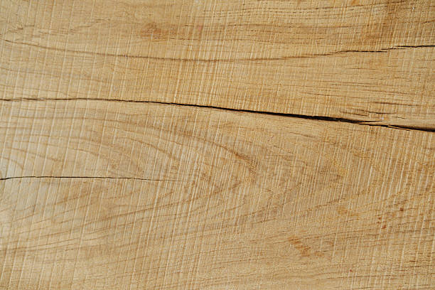 Natural wood grain surface with visible cracks and fine lines background detail texture