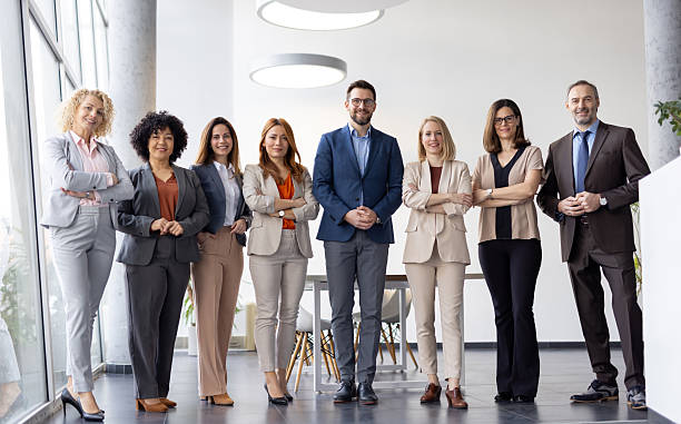 istock Motivated Business Team Smiling Brightly in Office Space 2251059721