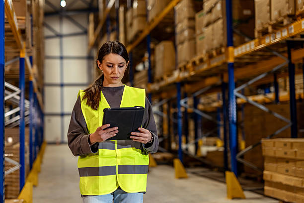 istock Warehouse Employee Using Digital Tablet for Inventory Management 2251059753