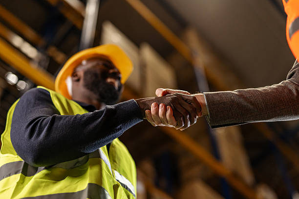 istock Professional Handshake Between Worker and Businessperson in an Industrial Setting 2251059827