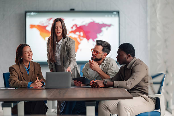 istock Diverse business team collaborating on global strategy using laptop 2251059881