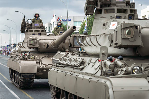 Nicosia, Cyprus - October 01, 2023: Military parade showing tanks on the street with soldiers driving during 63rd Cyprus Independence Day Parade in Nicosia