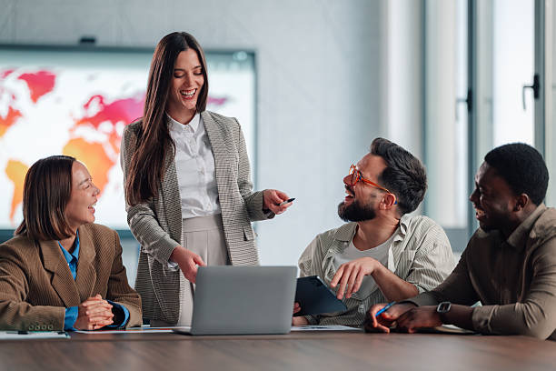 istock Diverse business team collaborating and laughing during office meeting 2251064117