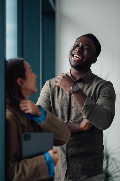 istock Diverse colleagues laughing and connecting in modern office 2251064446