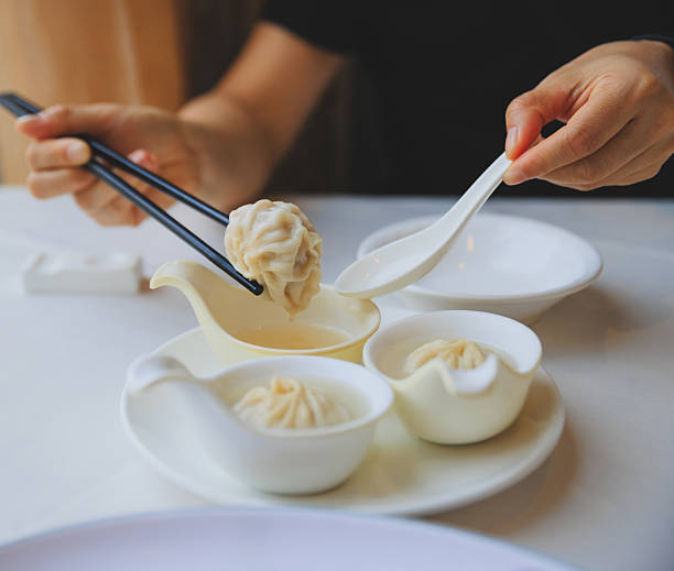 istock Eating Chinese food steamed bun 2251066393