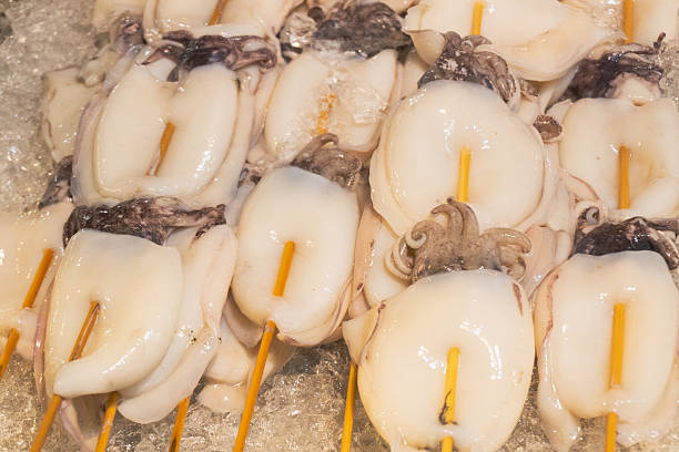 istock Street food skewer with grilled octopus or cuttlefish 2251071861