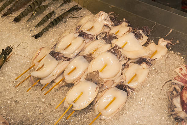 istock Street food skewer with grilled octopus or cuttlefish 2251071865