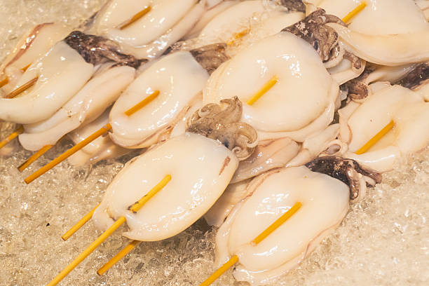 istock Street food skewer with grilled octopus or cuttlefish 2251071867