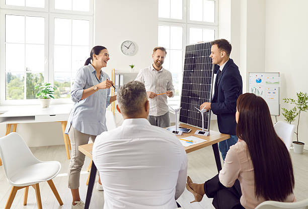 istock Businessman Presenting Solar Panels And Renewable Energy Sources To Clients 2251078553