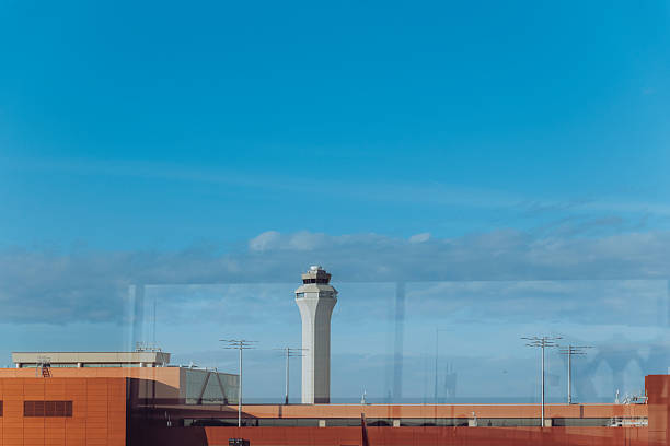 istock The airport control tower rises above the terminals under a clea 2251080128