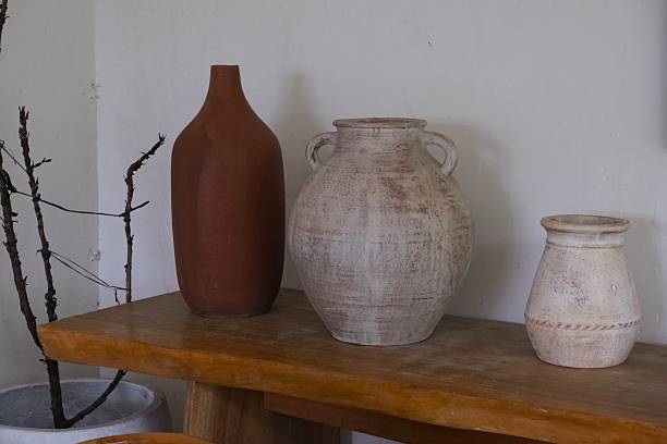 istock Rustic Clay and Ceramic Vases on Wooden Table 2251084119