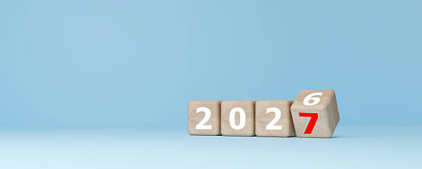 istock 2027 New Year Transition and Future Planning Concept with Rolling Wooden Dice 2251086990