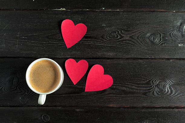 istock Enjoying coffee with heart-shaped decorations on a wooden table 2251101912