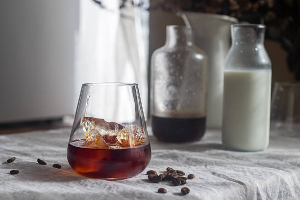istock Cold brew coffee in a clear glass with ice on a table. 2251104716