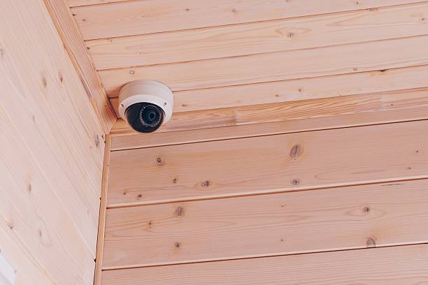 istock High-Definition Security Camera Mounted in a Wooden Ceiling Corner for Enhanced Surveillance and Safety Monitoring 2251106319