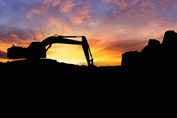 istock Crawler excavators silhouette are digging the soil. 2251106634