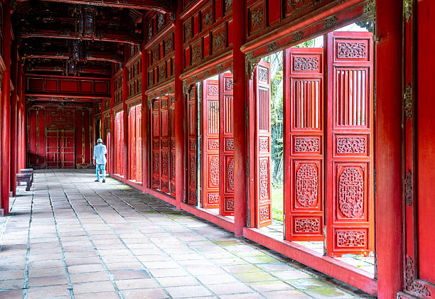 istock Ornate Red Hallway with Open Door Panels 2251110725